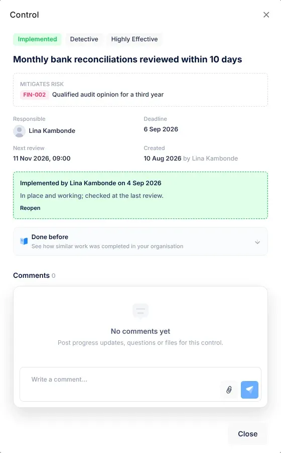 An implemented control's panel: the green Implemented badge, and a box saying who implemented it and on what date, with their notes and the Reopen link
